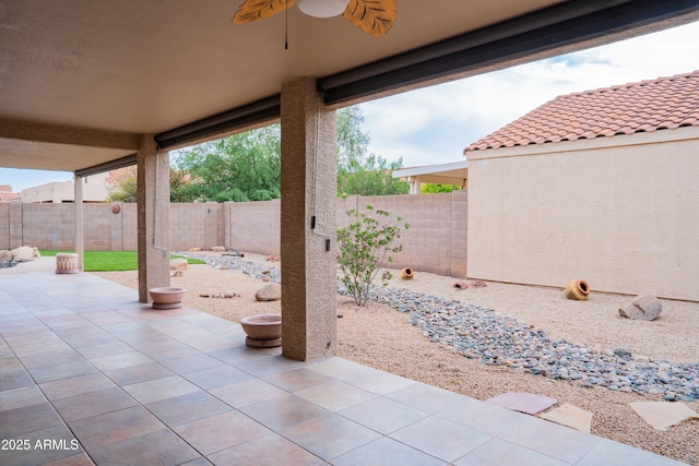 view of patio / terrace with a fenced backyard and ceiling fan