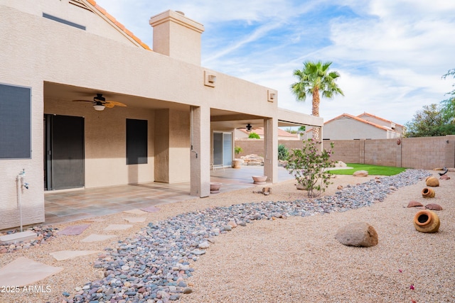 view of yard featuring a patio, ceiling fan, and fence private yard