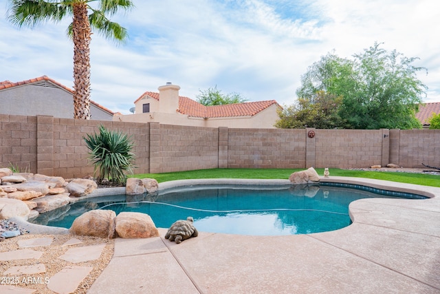 view of swimming pool with fence and a fenced in pool