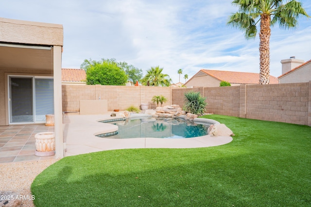 view of pool with a lawn, a fenced backyard, a fenced in pool, and a patio