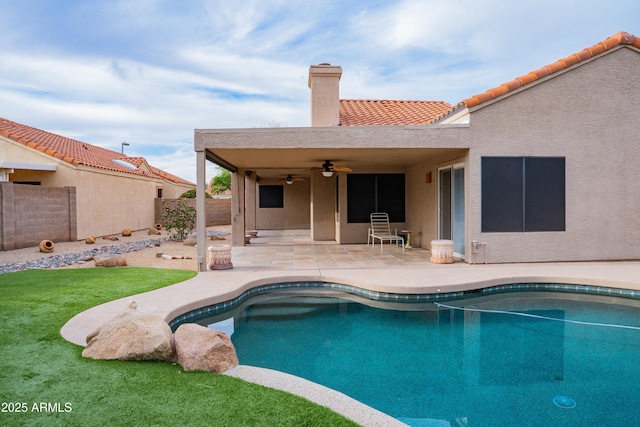 view of pool featuring a patio, a fenced in pool, a ceiling fan, and fence private yard