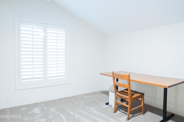 office area with carpet and vaulted ceiling
