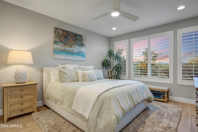 bedroom featuring light hardwood / wood-style floors and ceiling fan