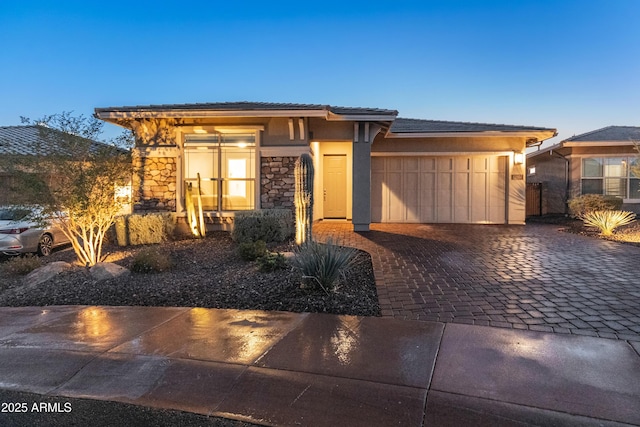 prairie-style house featuring a garage