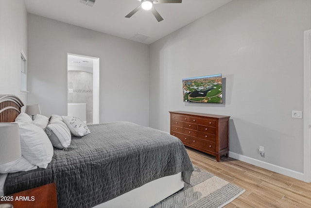 bedroom with ceiling fan, light hardwood / wood-style floors, and connected bathroom