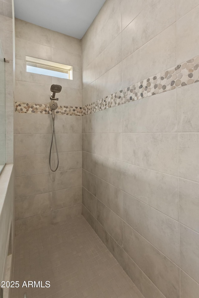 bathroom featuring tiled shower