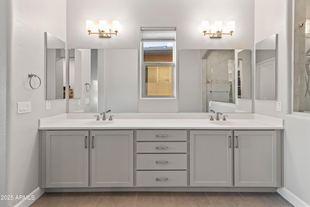 bathroom featuring tile patterned flooring, vanity, and walk in shower