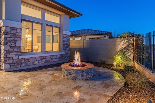 view of patio / terrace featuring an outdoor fire pit