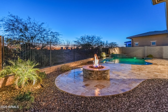 view of pool featuring a fire pit and a patio area