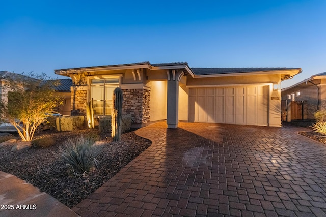 prairie-style home featuring a garage