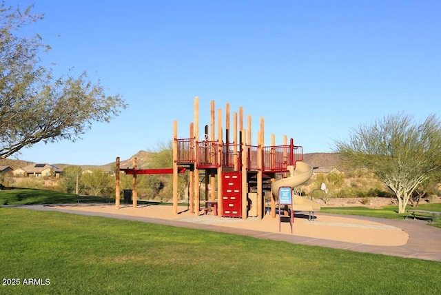 view of jungle gym with a lawn