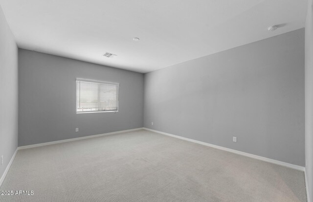 17809 W Getty Dr, Goodyear, AZ 85338 - spare room with baseboards, visible vents, and carpet