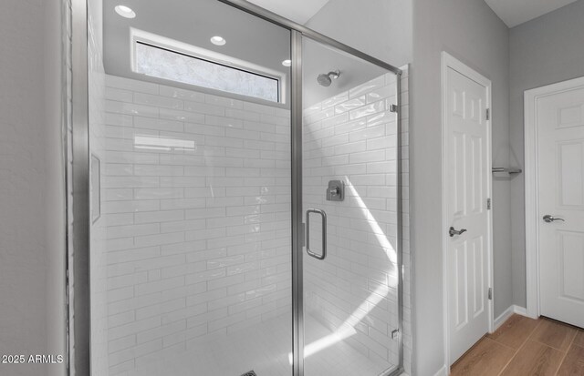 17809 W Getty Dr, Goodyear, AZ 85338 - full bathroom with recessed lighting, a shower stall, baseboards, and wood finished floors