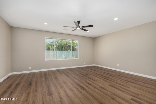 13805 N 31st Ave, Phoenix, AZ 85053 - unfurnished room featuring a ceiling fan, wood finished floors, and recessed lighting