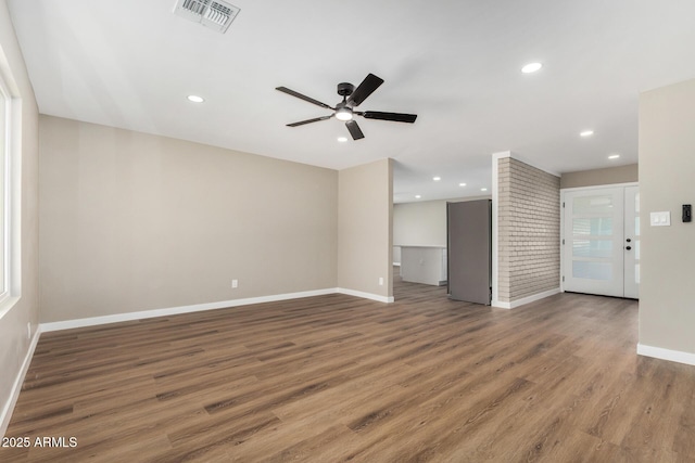 13805 N 31st Ave, Phoenix, AZ 85053 - unfurnished living room featuring a ceiling fan, wood finished floors, and recessed lighting