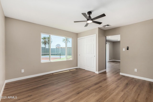 13805 N 31st Ave, Phoenix, AZ 85053 - unfurnished room featuring wood finished floors and ceiling fan
