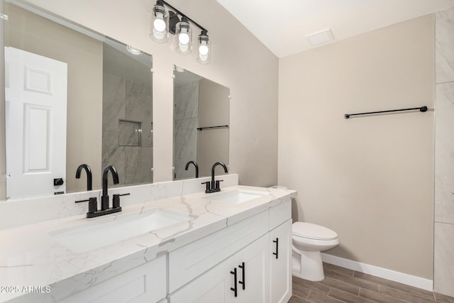 13805 N 31st Ave, Phoenix, AZ 85053 - bathroom featuring wood finish floors, double vanity, and walk in shower