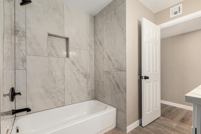 13805 N 31st Ave, Phoenix, AZ 85053 - bathroom with shower / washtub combination and wood finished floors