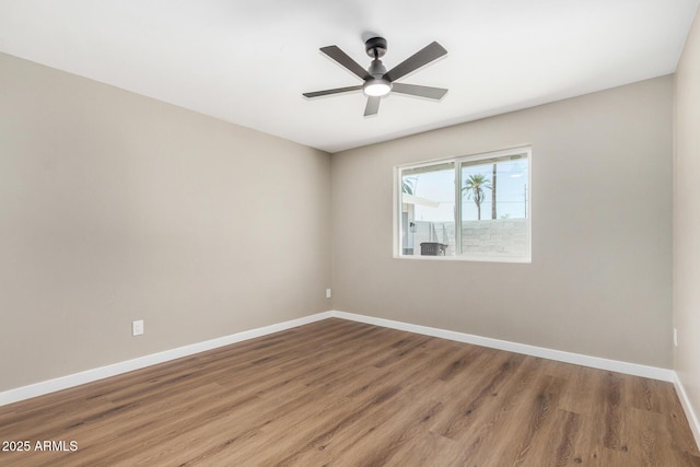 13805 N 31st Ave, Phoenix, AZ 85053 - empty room with wood finished floors and a ceiling fan