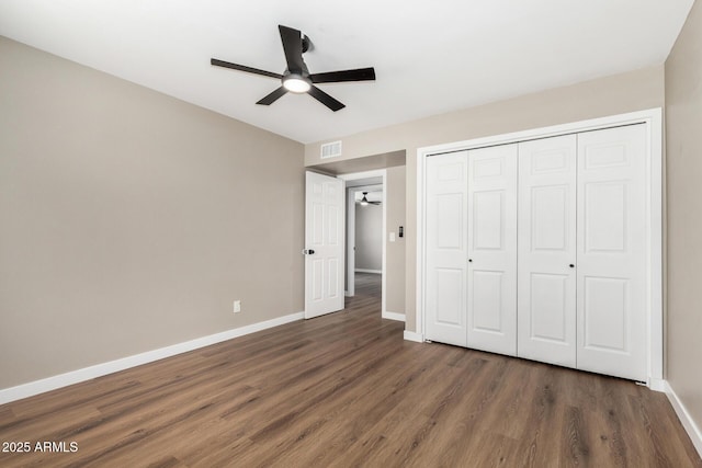 13805 N 31st Ave, Phoenix, AZ 85053 - unfurnished bedroom featuring wood finished floors, a closet, and a ceiling fan