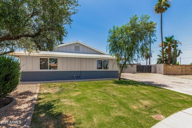 13805 N 31st Ave, Phoenix, AZ 85053 - view of property exterior with brick siding, board and batten siding, and concrete driveway