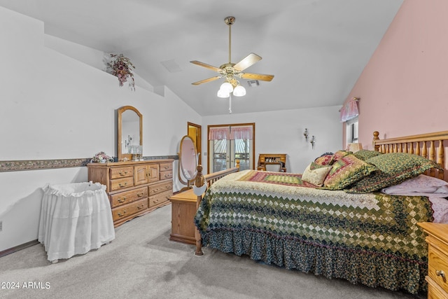 bedroom featuring vaulted ceiling, ceiling fan, and light colored carpet