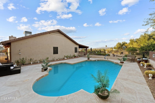 view of swimming pool with a patio area