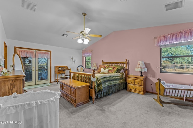 bedroom featuring vaulted ceiling, light carpet, ceiling fan, and access to exterior