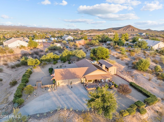 birds eye view of property with a mountain view