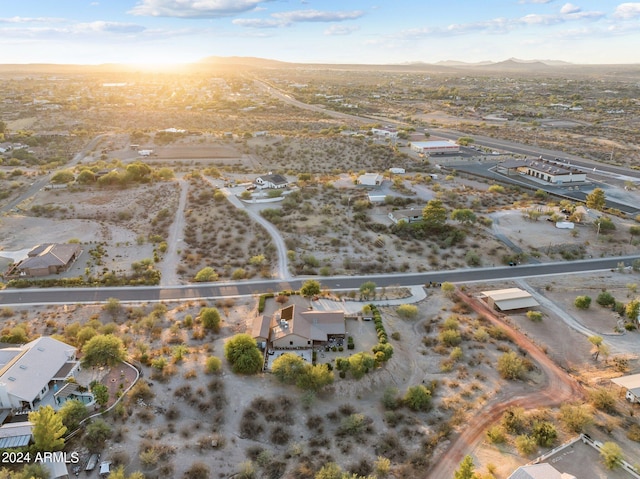 birds eye view of property with a mountain view