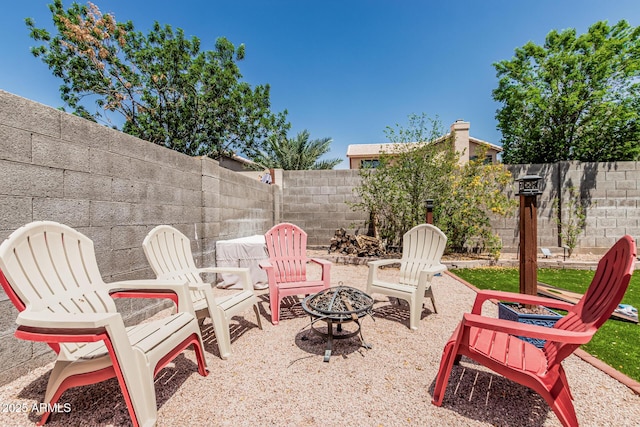 51 N Rush St, Chandler, AZ 85226 - view of patio / terrace with a fire pit and a fenced backyard