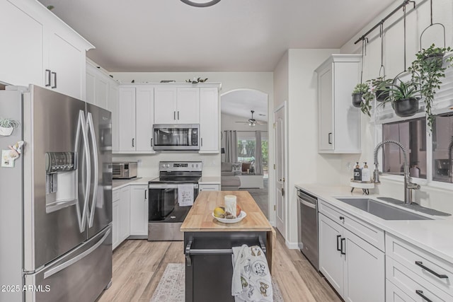 51 N Rush St, Chandler, AZ 85226 - kitchen featuring stainless steel appliances, a sink, light wood-type flooring, butcher block counters, and white cabinetry