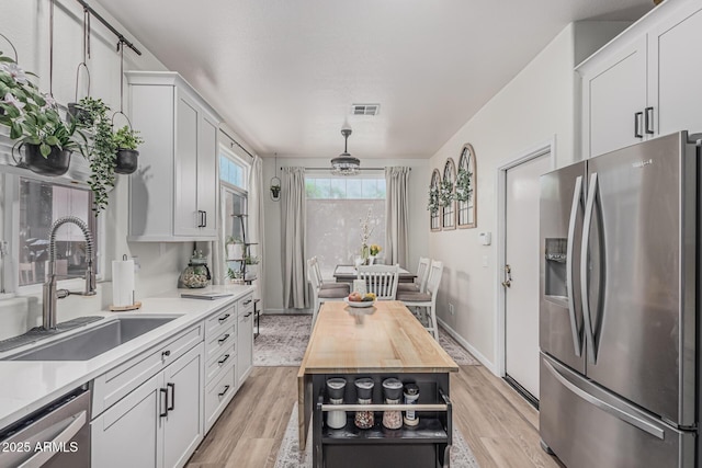 51 N Rush St, Chandler, AZ 85226 - kitchen with stainless steel appliances, a sink, and white cabinets