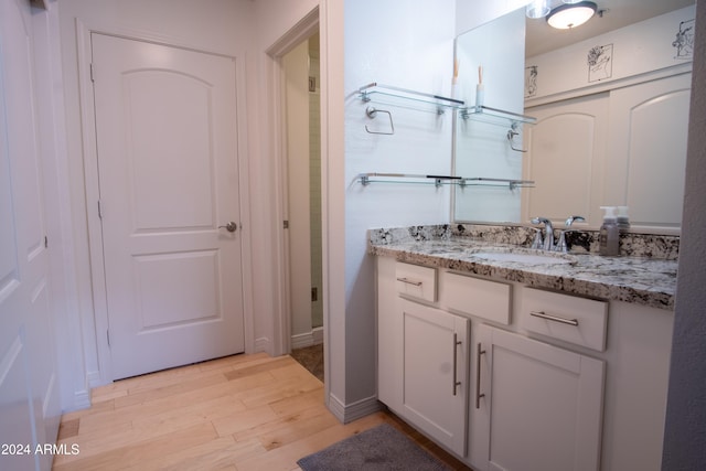 bathroom featuring vanity and hardwood / wood-style flooring