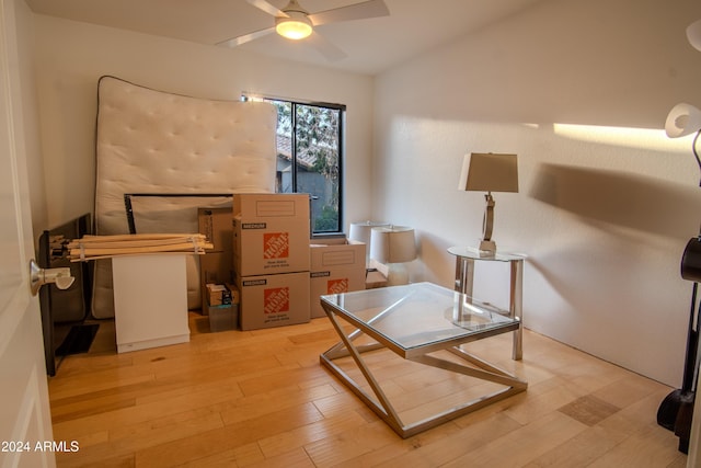 home office featuring hardwood / wood-style flooring and ceiling fan