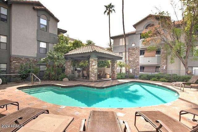 view of pool with a gazebo and a patio