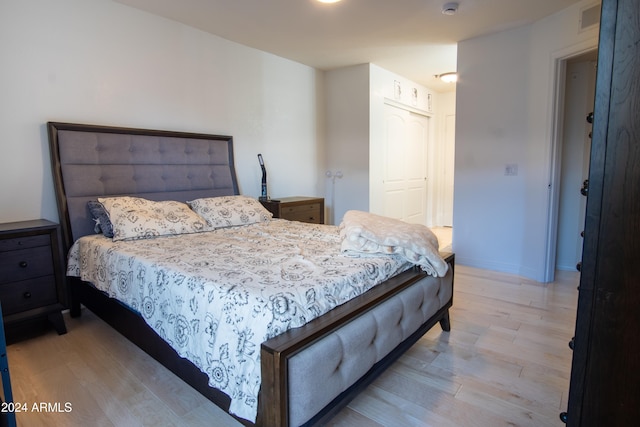 bedroom with a closet and light wood-type flooring