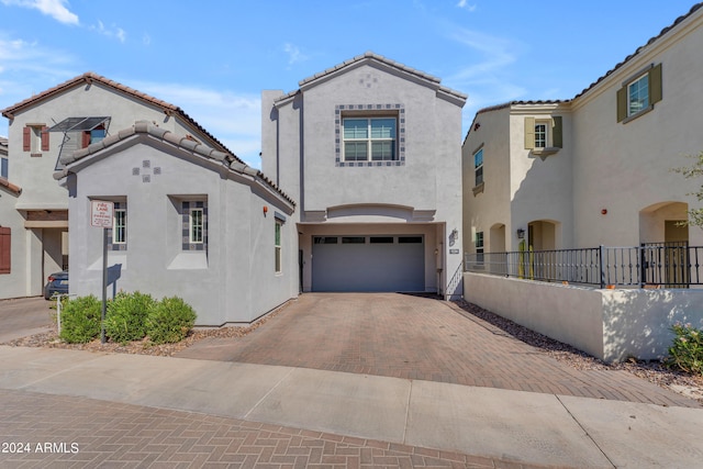 mediterranean / spanish house with a garage