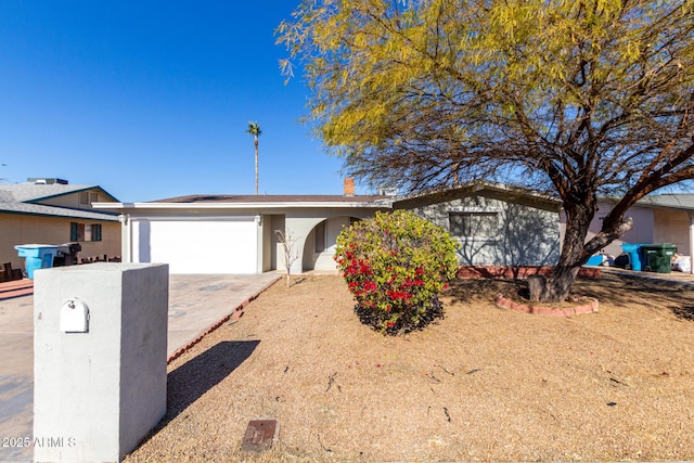 ranch-style home featuring a garage