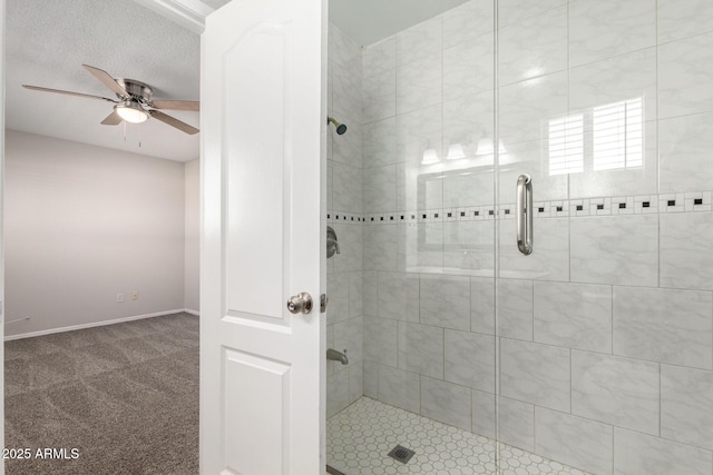 bathroom with an enclosed shower, a textured ceiling, and ceiling fan