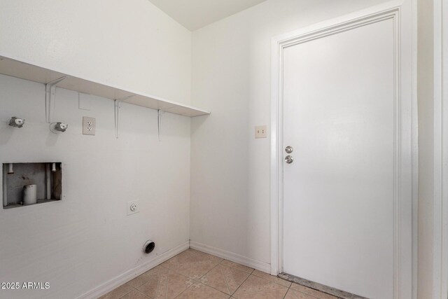 laundry room featuring hookup for an electric dryer and light tile patterned floors