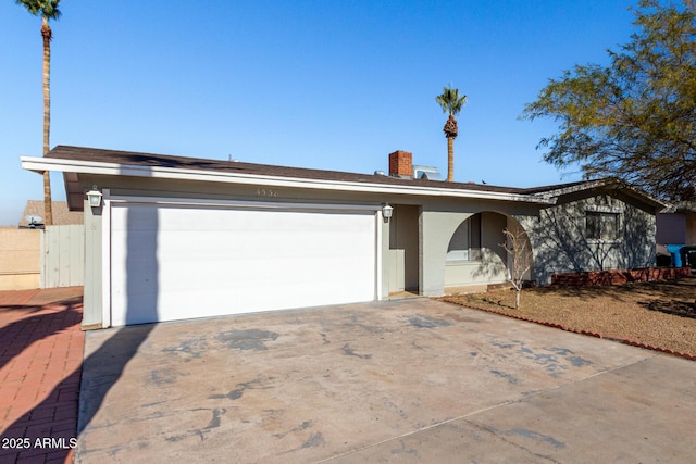 ranch-style home with a garage