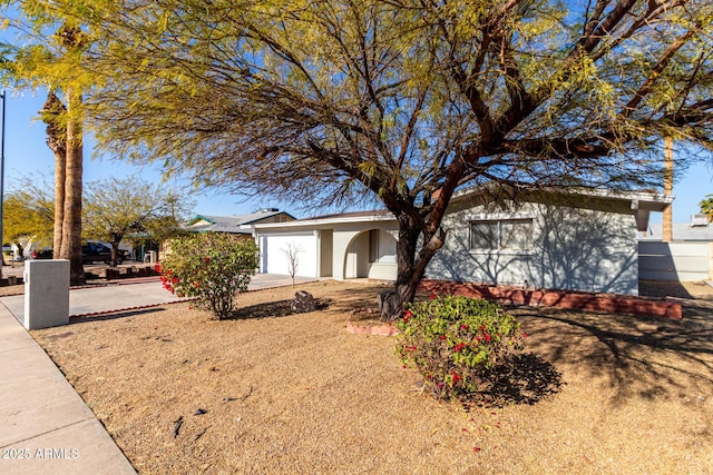 ranch-style house featuring a garage