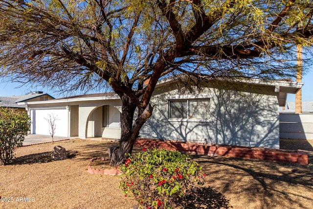 view of side of property with a garage