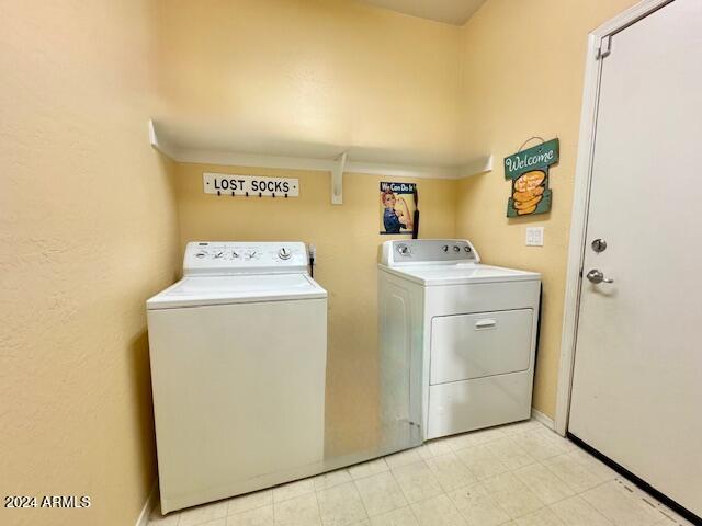 laundry area with washer and dryer