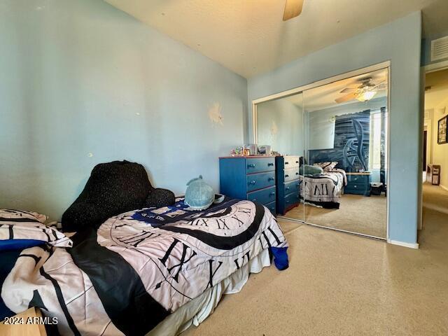 bedroom featuring a closet and ceiling fan