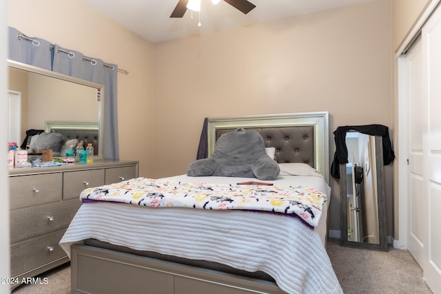 carpeted bedroom featuring a ceiling fan