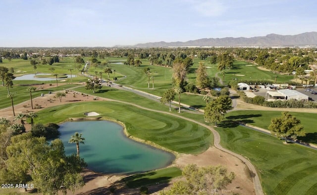 aerial view with a water and mountain view and view of golf course