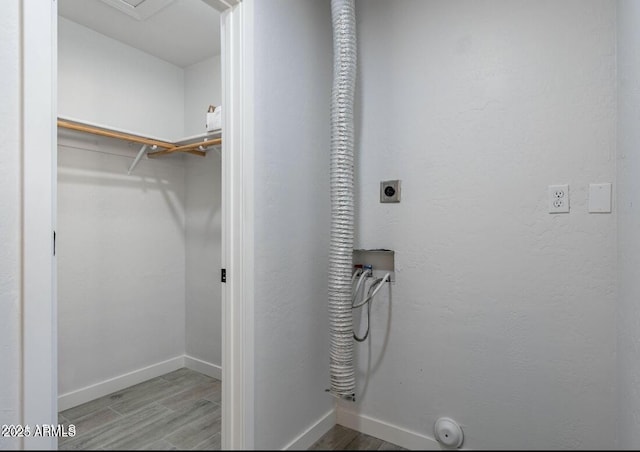 7101 N 36th Ave Unit 102, Phoenix, AZ 85051 - laundry room with hookup for a washing machine, electric dryer hookup, baseboards, and wood finished floors