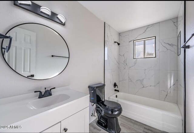 7101 N 36th Ave Unit 102, Phoenix, AZ 85051 - bathroom featuring vanity, tub / shower combination, and toilet